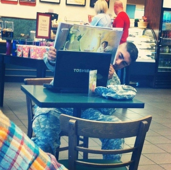 Reading A Storybook To His Child Over Skype